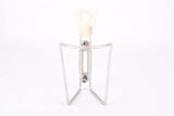 White REG #1975/50 Dural aluminum alloy water bottle cage from the 1970s - 1980s