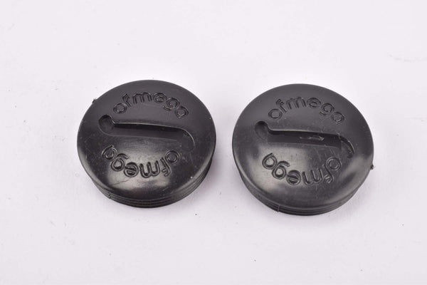 NOS Ofmega black plastic crank dust cap from the 1980s