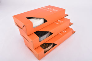 VeloOrange Rubbery Handlebar Tape in black, white, brown
