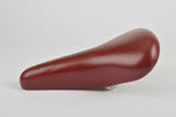 NEW Touring vinyl Saddle in dark red with seatpost clamp from 1985 NOS
