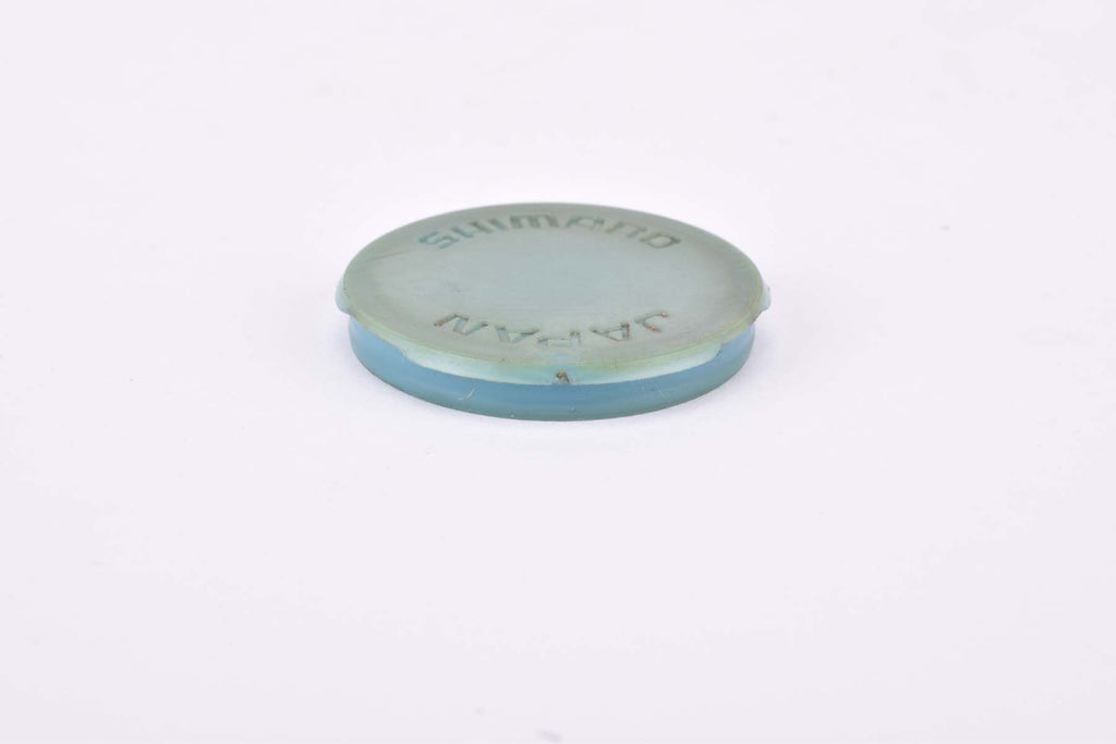 single Shimano DuraAce 7200 pedal dust cap from the 1980s