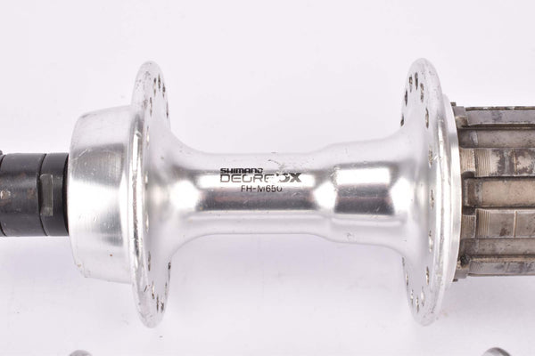 Vintage stříbrné néboje Shimano Deore DX M650 7speed rozteč 100/130mm Vintage stříbrné néboje Shimano Deore DX M650 7speed rozteč 100/130mm