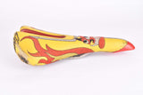 Yellow and red Selle Italia Mythos EL Diablo Saddle from the 1990s
