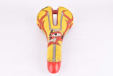 Yellow and red Selle Italia Mythos EL Diablo Saddle from the 1990s