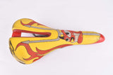 Yellow and red Selle Italia Mythos EL Diablo Saddle from the 1990s