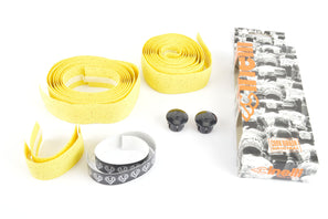 NOS/NIB Cinelli cork yellow handlebar tape with black end plugs from the 1990s