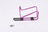 NOS pink / purple anodized Tacx water bottle cage from the 1990s / 2000s