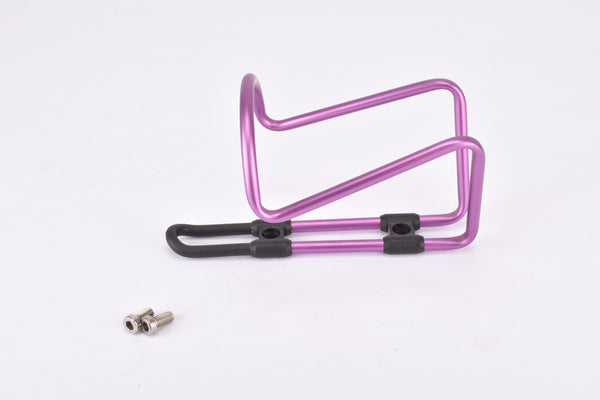 NOS pink / purple anodized Tacx water bottle cage from the 1990s / 2000s