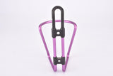 NOS pink / purple anodized Tacx water bottle cage from the 1990s / 2000s