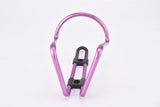 NOS pink / purple anodized Tacx water bottle cage from the 1990s / 2000s