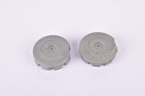 Grey Shimano plastic crank set dust caps