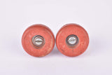 Red Velox screw on handlebar end plugs from the 1950s