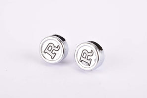 NOS R labled Pedal Strap Caps pair