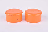 Orange Benotto handlebar end plugs