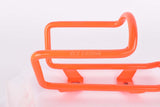 NOS neon orange Wheeler MTB water bottle cage from the 1990s