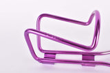 NOS purple anodized Wheeler water bottle cage from the 1990s