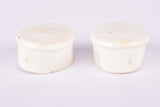 White Benotto handlebar end plugs