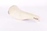 White Puch labled Selle San Marco Concor Supercorsa Laser Saddle from the 1980s - 1990s
