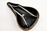 Brown Cinelli Unicanitor leather covered saddle in black from the 70s - 80s